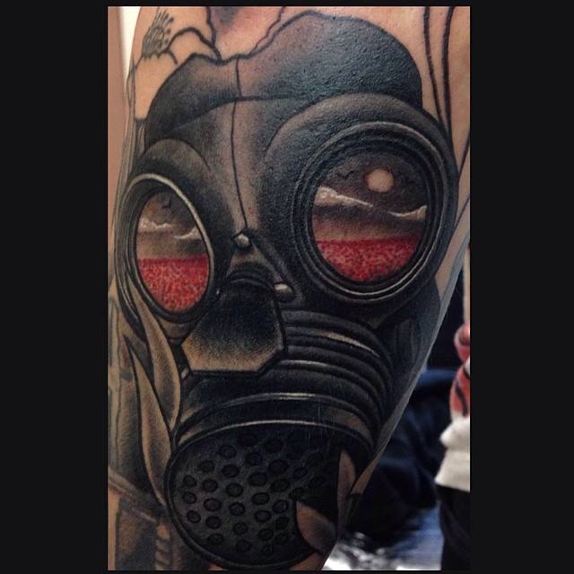 Black Gas mask tattoo on sleeve by Lauren Gow