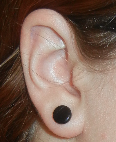 Black Gauge Ear Lobe Piercing.