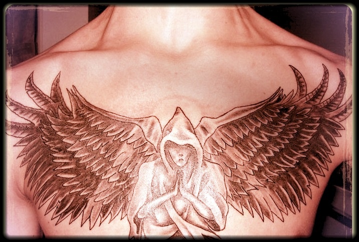 Black and grey praying angel tattoo on chest
