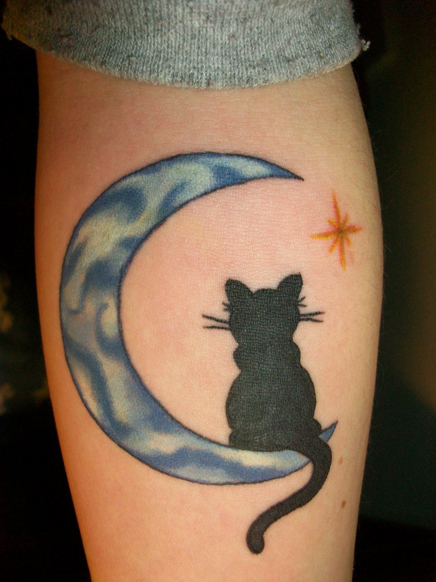 Blue moon and black cat tattoo on leg