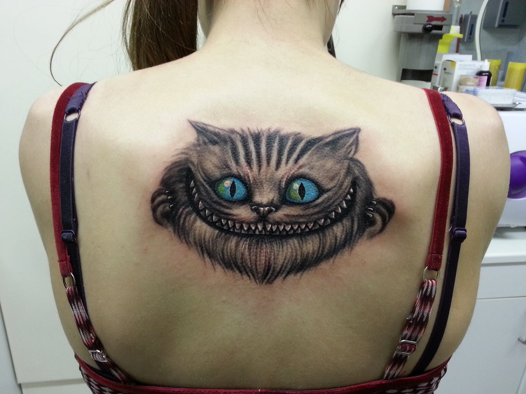 Cat tattoo on girl back by zakknoir
