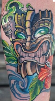 Color Flower And Tiki Tattoo