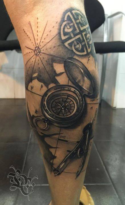 Compass and divider tattoo on leg