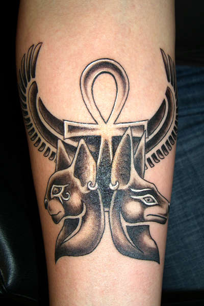Egyptian Anubis And Bastet Tattoo On Arm