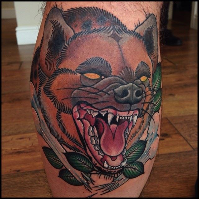 Hyena tattoo on back calf by Lauren Gow
