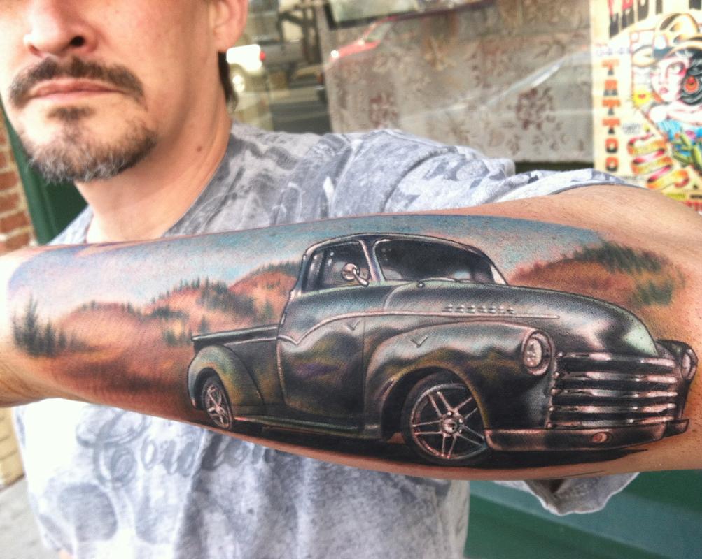 Realistic Car Tattoo On Man Left Arm