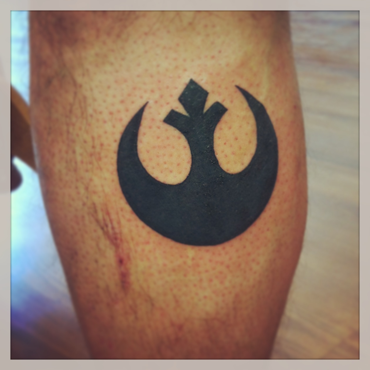 Rebel Alliance Tattoo On Leg