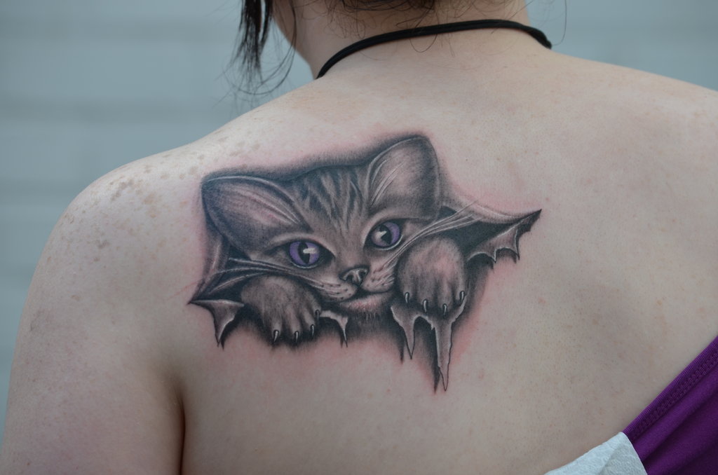 Ripped skin cat tattoo by Zakknoir