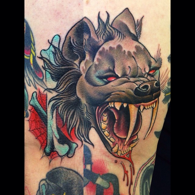 Saber tooth hyena tattoo by Dusty Neal