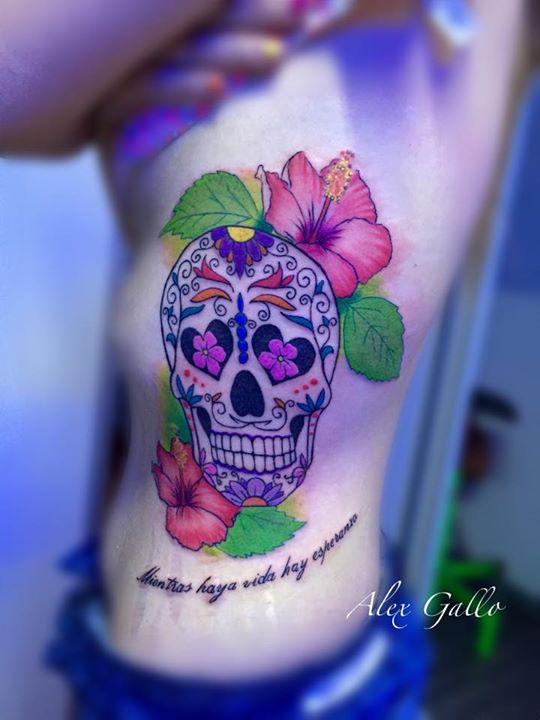 Sugar Skull with lily flowers tattoo on siderib