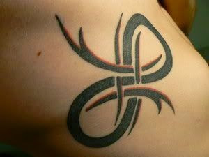 Tribal Infinity Symbol Tattoo On Rib Cage