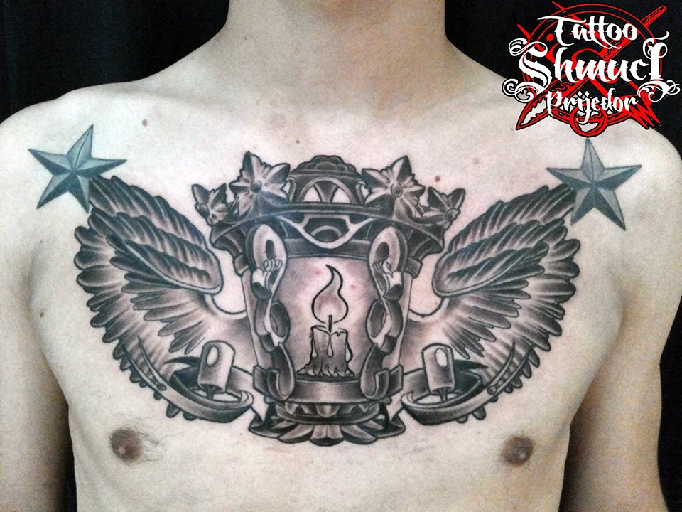 Winged candle lamp tattoo on chest by shmuci tattoo