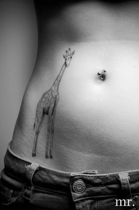 Beautiful Giraffe tattoo on girl's hip