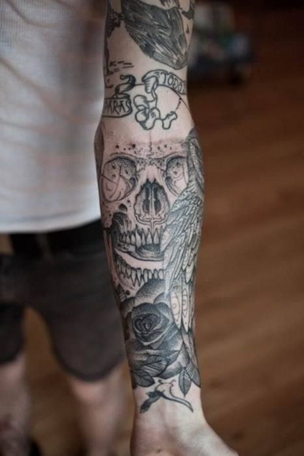 Black Skull, rose and owl tattoo on forearm