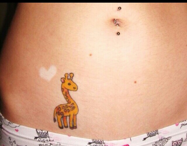 2 Beautiful Giraffe Tattoos on hip