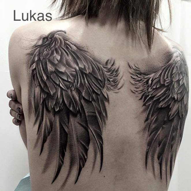 Incredible Black & grey Wings tattoo on Girl's back
