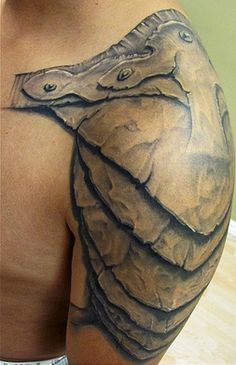 Man Left Shoulder Armor Tattoo