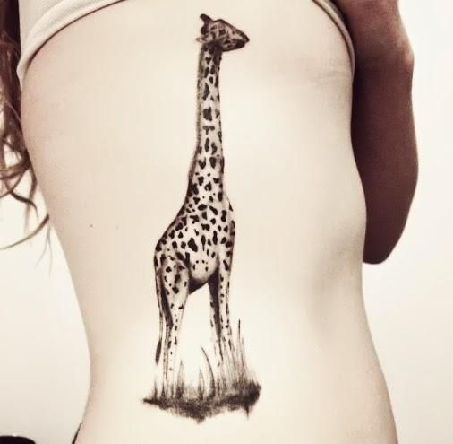 Realistic Giraffe tattoo on girl's siderib