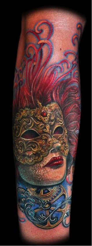 Red-headed woman wearing an ornate gold Venetian Colombian mask tattoo