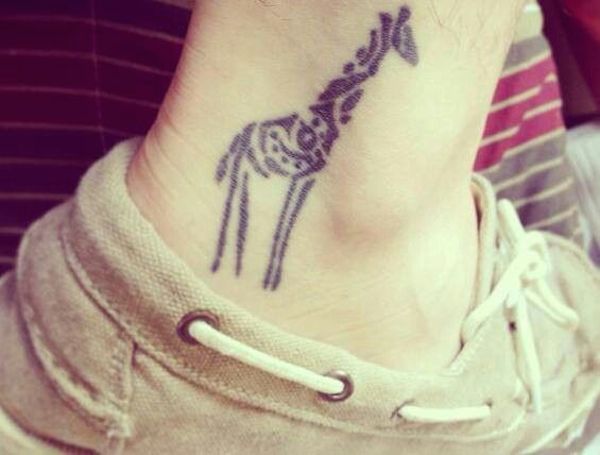 Small tribal giraffe tattoo on neck