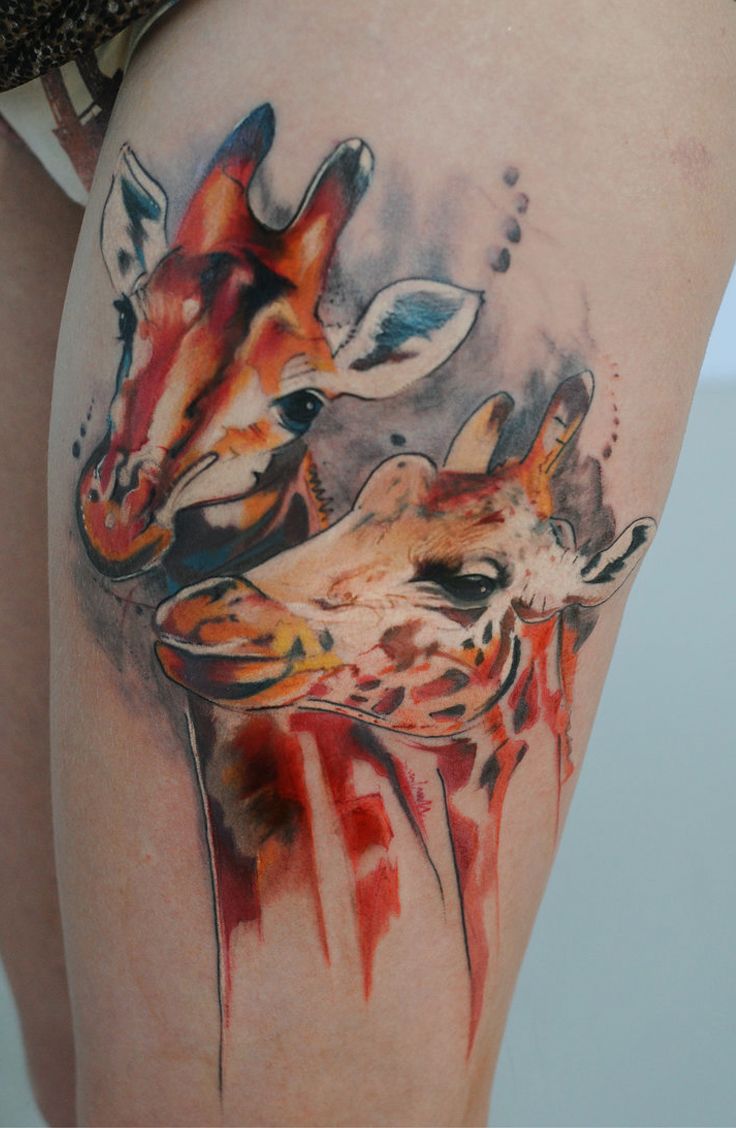 Watercolor Giraffe Tattoo On Woman's Thigh
