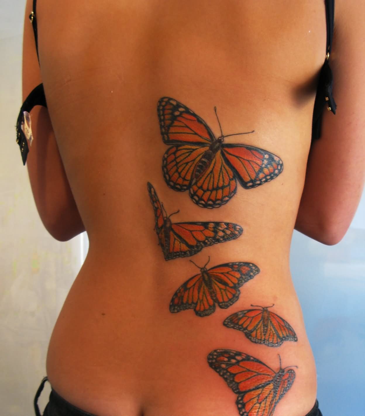 Amazing Colorful Butterflies Tattoo On Girl Back