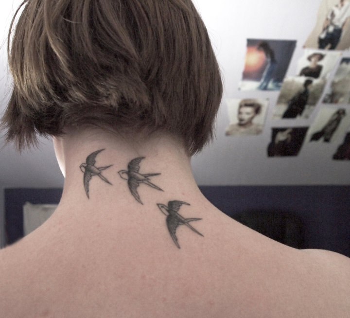 Black And Grey Three Flying Swallow Tattoo On Girl Back Neck
