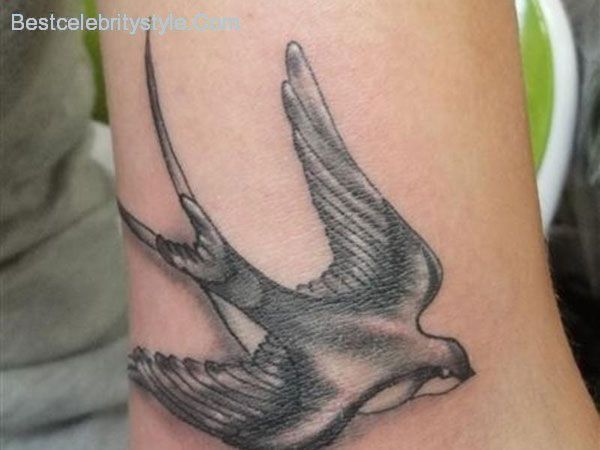 Black And Grey Flying Swallow Tattoo On Half Sleeve