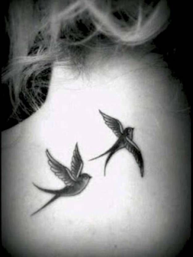 Black And Grey Flying Swallows Tattoo On Girl Upper Back