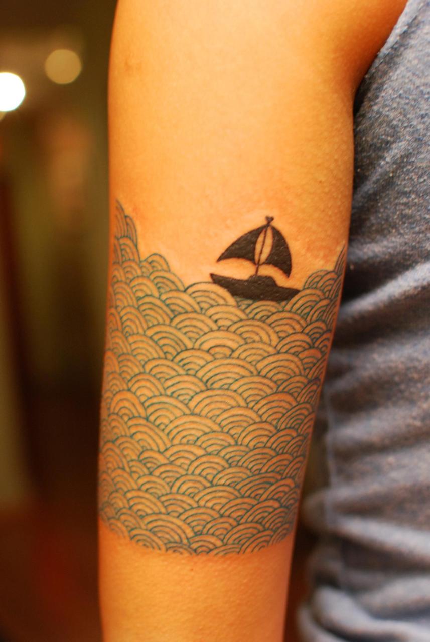 Black Boat On Ocean Tattoo On Forearm