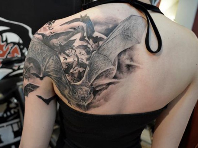 Black Flying Bats Tattoo On Girl Back Shoulder