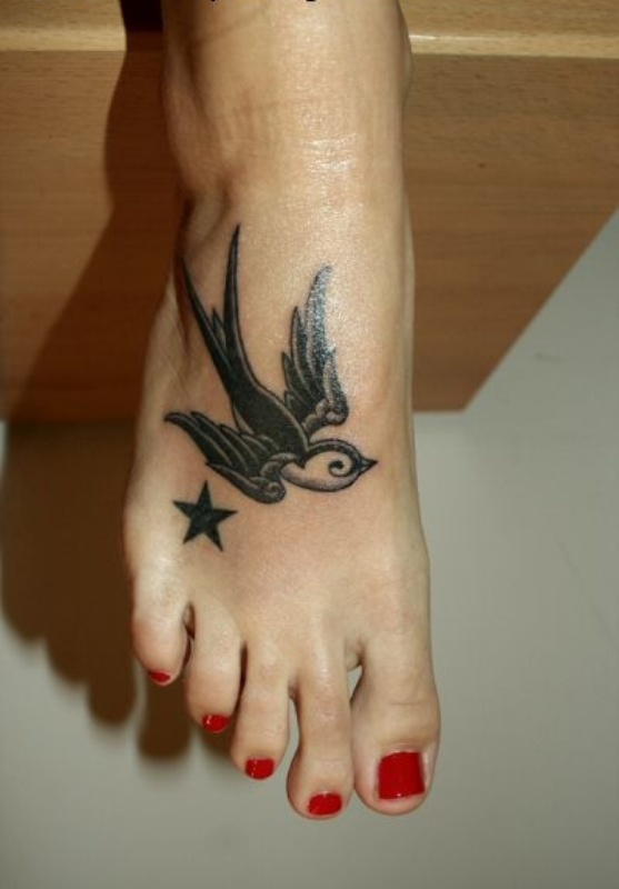 Black Flying Swallow Tattoo On Girl Right Foot