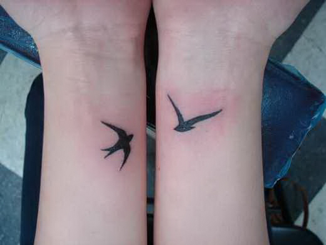 Black Flying Swallow Tattoo On Wrists