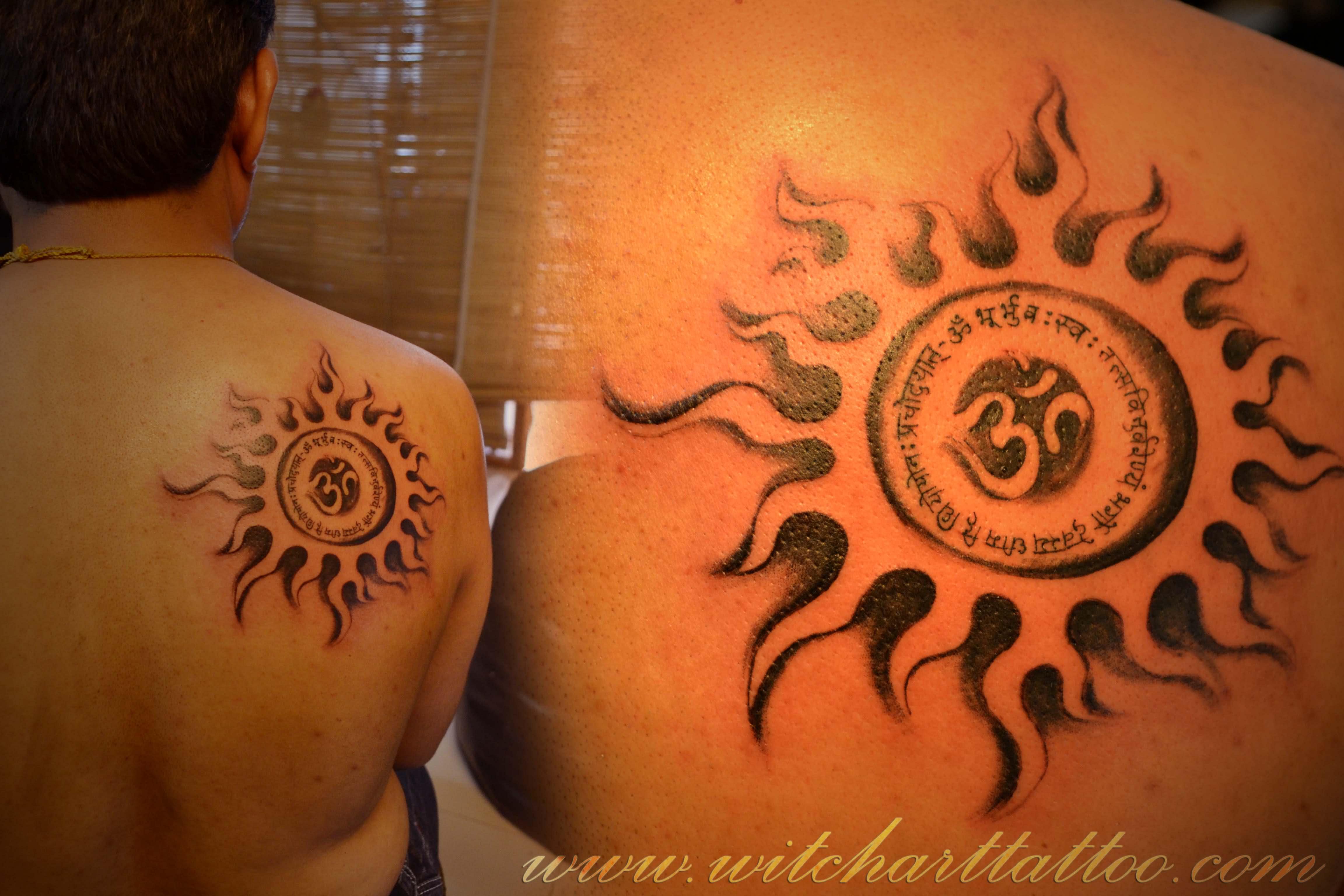 Black Om In Sun Tattoo On Man Back Shoulder