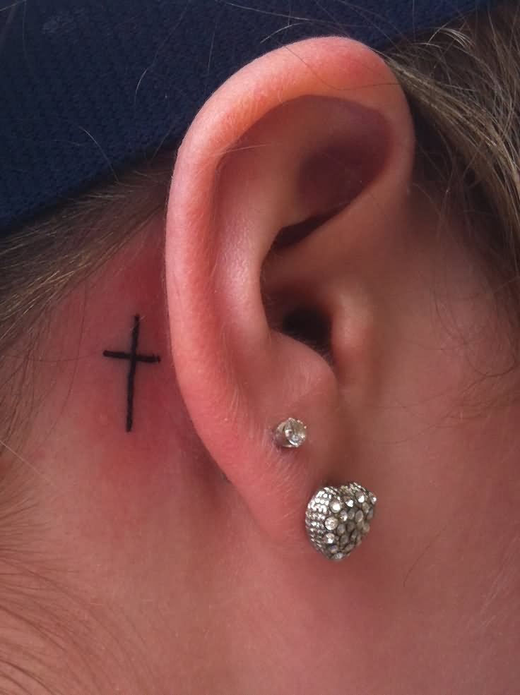 Black Simple Cross Tattoo On Behind The Ear