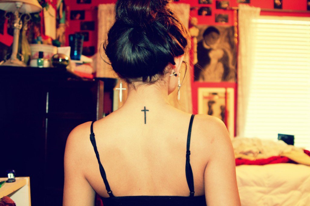 Black Simple Cross Tattoo On Girl Back Neck
