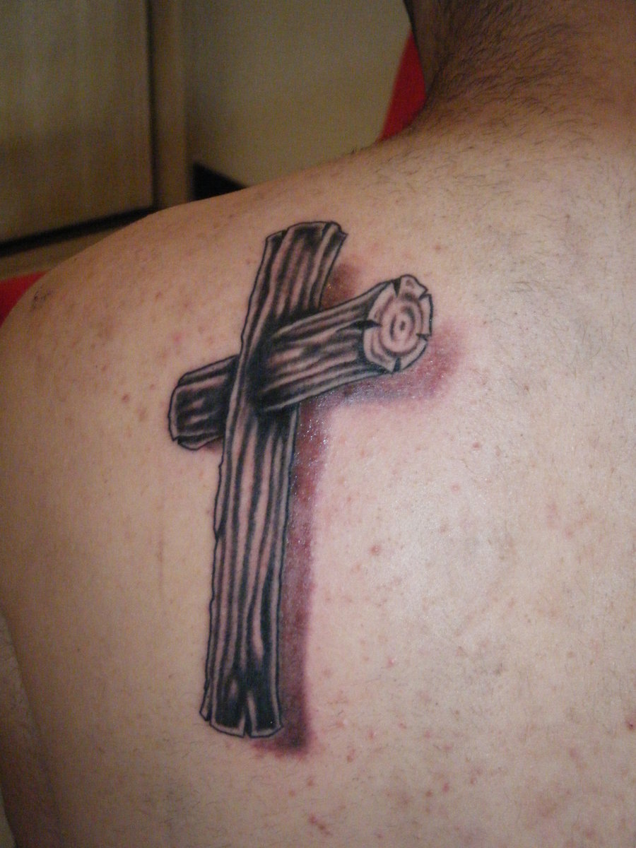 Black Wooden Cross Tattoo On Man Back Shoulder