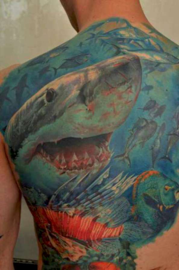 Colorful 3D Sharks In Ocean Tattoo On Man Back