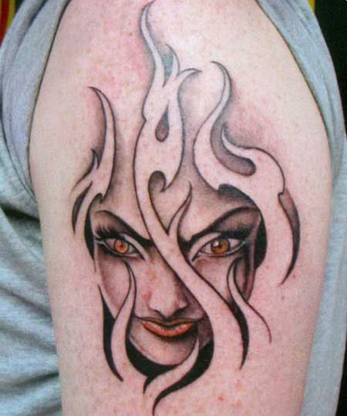 Lady Face In Tribal Flames Tattoo On Half Sleeve