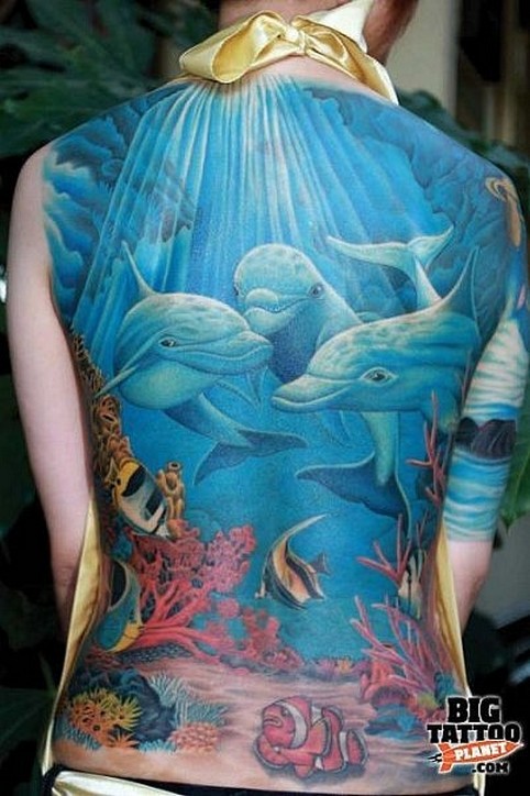 Colorful Dolphins In Underwater Ocean Tattoo On Full Back