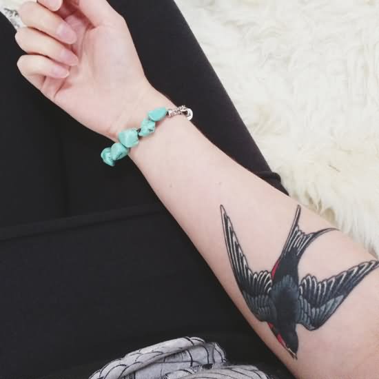 Colorful Flying Swallow Tattoo On Girl Forearm