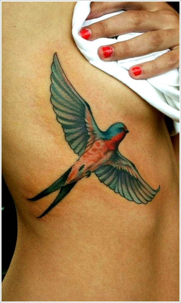 Colorful Flying Swallow Tattoo On Side Rib