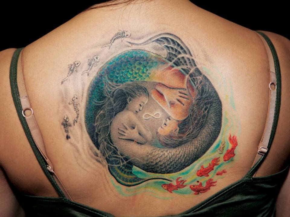 Colorful Sleeping Mermaids In Ocean Tattoo On Girl Upper Back Shoulder