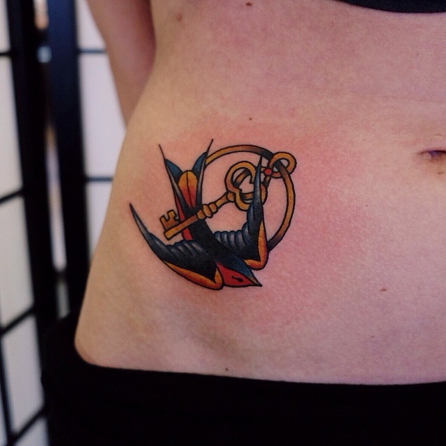 Colorful Swallow Key Ring Tattoo On Stomach