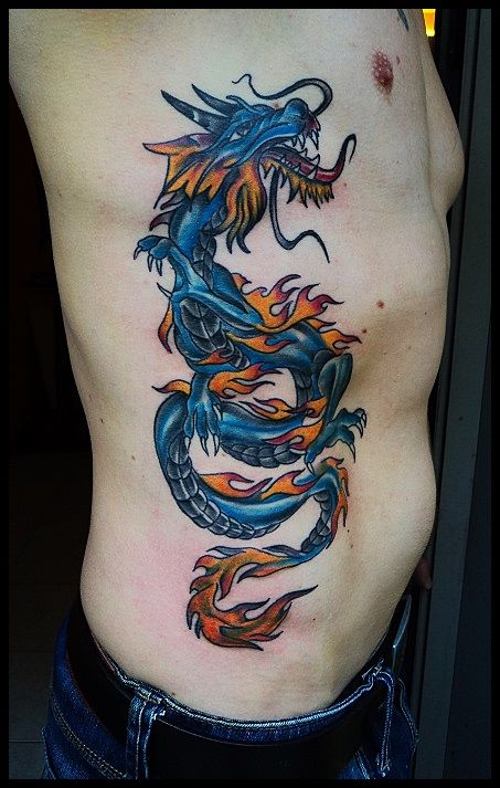 Colorful dragon tattoo on siderib by Salamandra