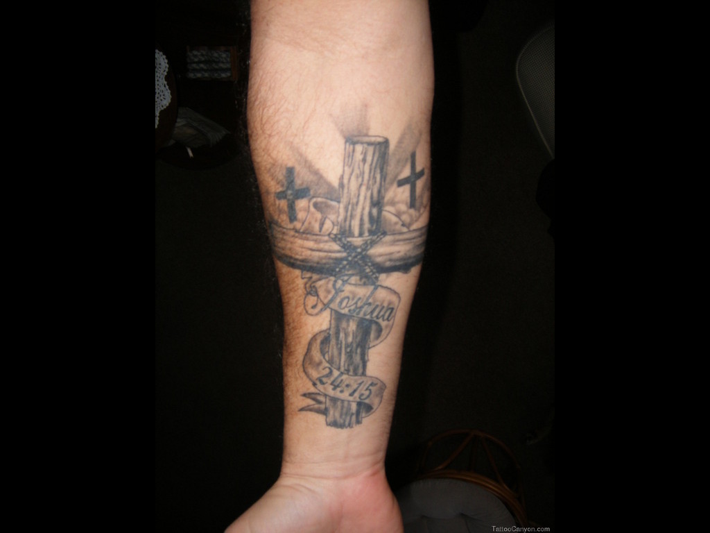 Cool Black Wooden Cross With Banner Tattoo On Wrist