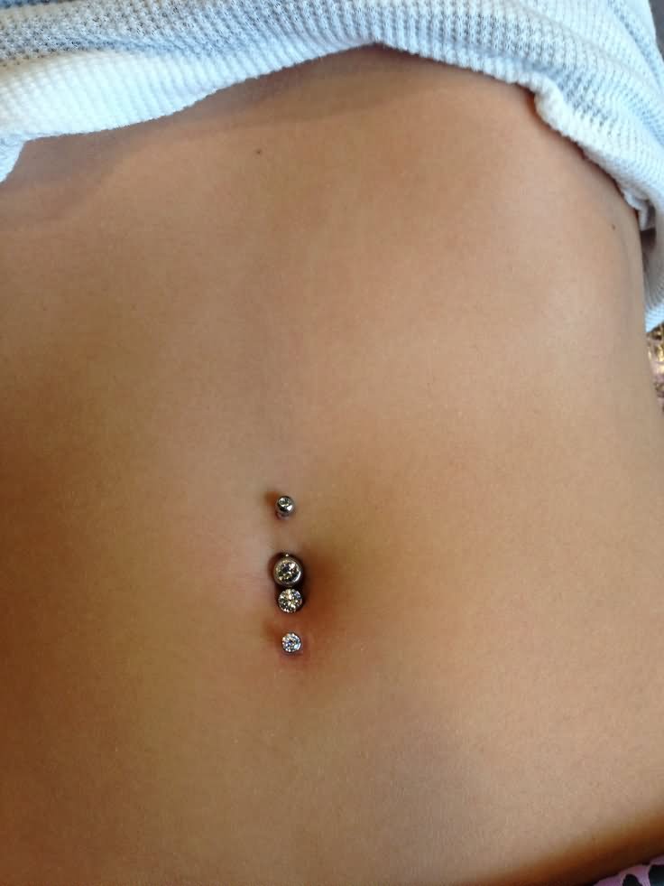 Dual Vertical Navel Piercing Picture