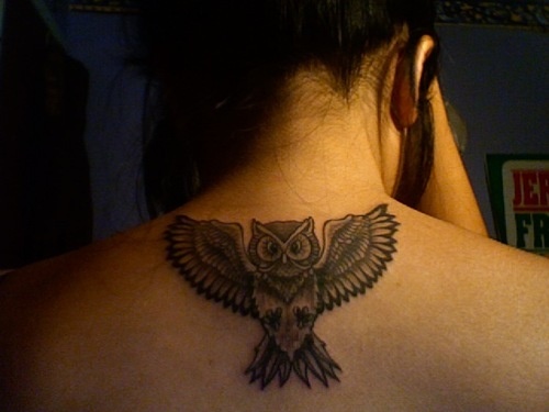 Grey Ink Flying Owl Tattoo On Girl Upper Back
