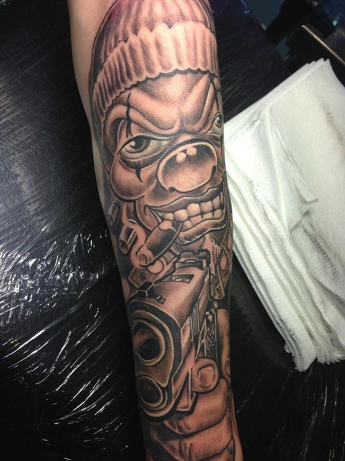 Grey Smoking Gangster Clown Tattoo With Gun On Arm Sleeve