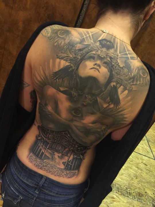 Incredible back tattoo by Carl Grace